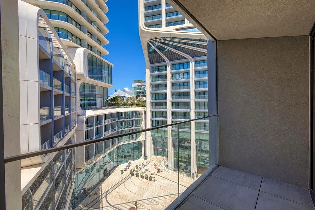 Furnished Mercury Suites home with balcony and pool access — 2